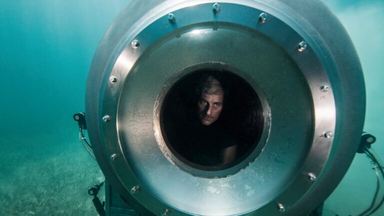Stockton Rush looks out from inside a submersible