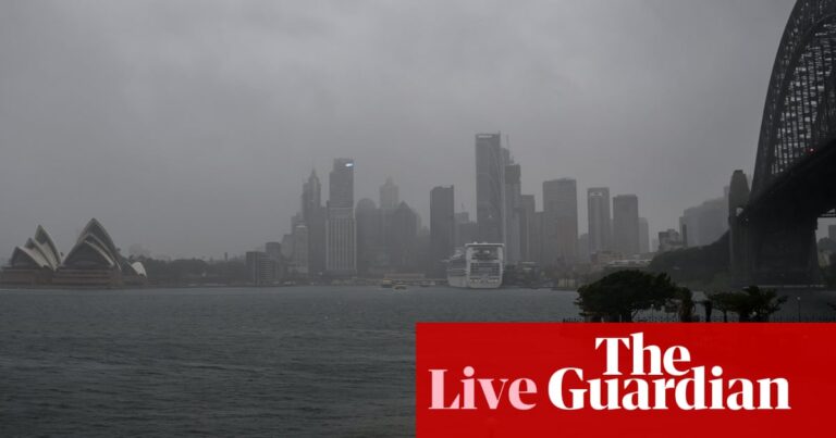 Australia news live: Sydney train passengers told to avoid non-essential travel as wild weather continues; flood warnings for NSW South Coast | Australia news