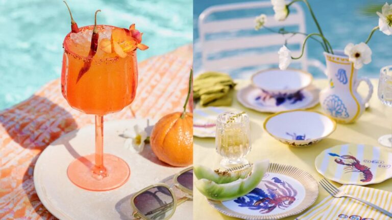 orange-hued wine glass resting by a pool; elaborate tablescape featuring colorful plates, a vase, fresh fruit, and live flowers