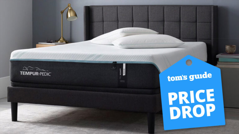 Tempur-Pedic Tempur-ProAdapt mattress in a grey bedroom, with a Tom's Guide badge overlaid saying &quot;PRICE DROP&quot;