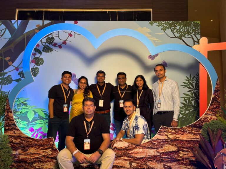 Nitin and his sales team posing together for a photo.