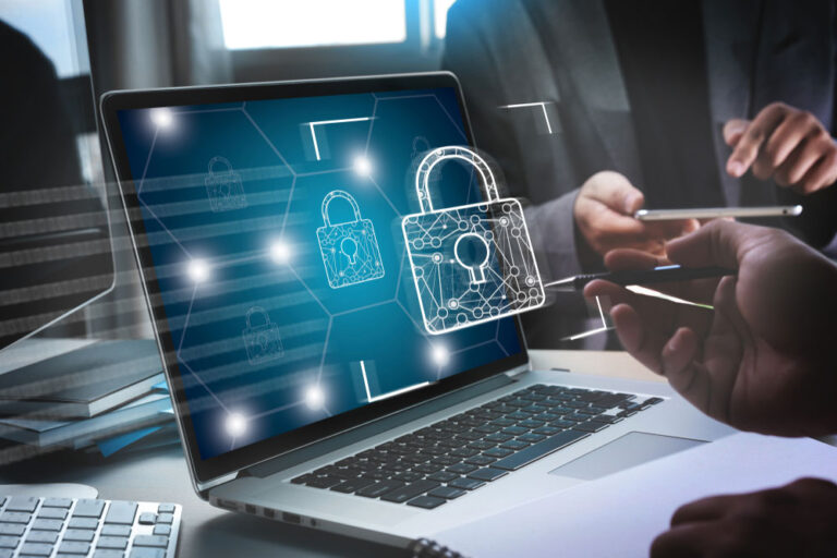 A person securing their laptop with antivirus software