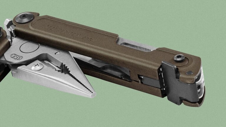 Close-up of a Leatherman ARC multi-tool showing the pliers partially extended. The tool has a brown handle with visible screws and a metal body, set against a plain green background.