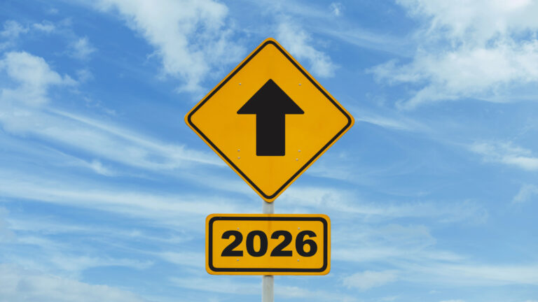Close-up of a finger touching a loading bar transitioning from 2025 to 2026, representing vision, innovation, and the future. Ideal for illustrating technological progress and forward-thinking concept