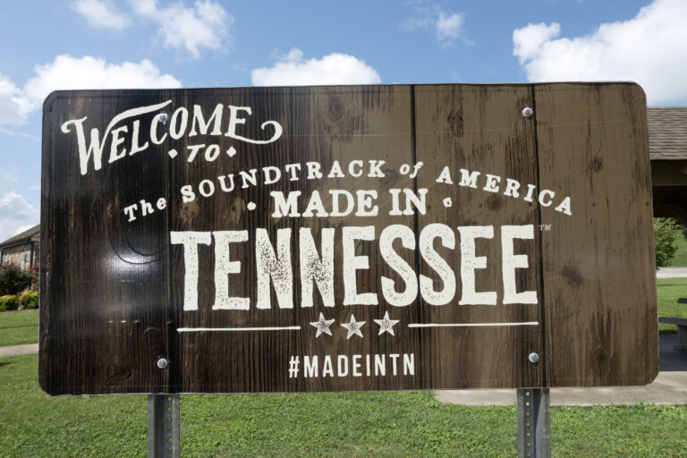wooden sign that reads &quot;Welcome to the soundtrack of America made in Tennessee&quot;