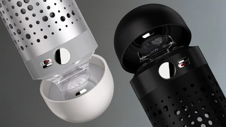 Two cylindrical devices with perforated metal bodies, one in silver and white and the other in black, each featuring a round button and a small switch near the top. The top caps of both devices are open, revealing a transparent inner component. The design appears modern and sleek, with a focus on ventilation or sound transmission.
