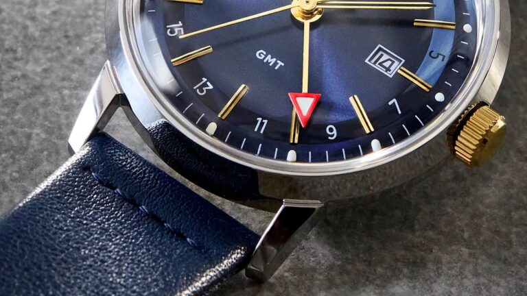 the blue dial of a Timex GMT watch