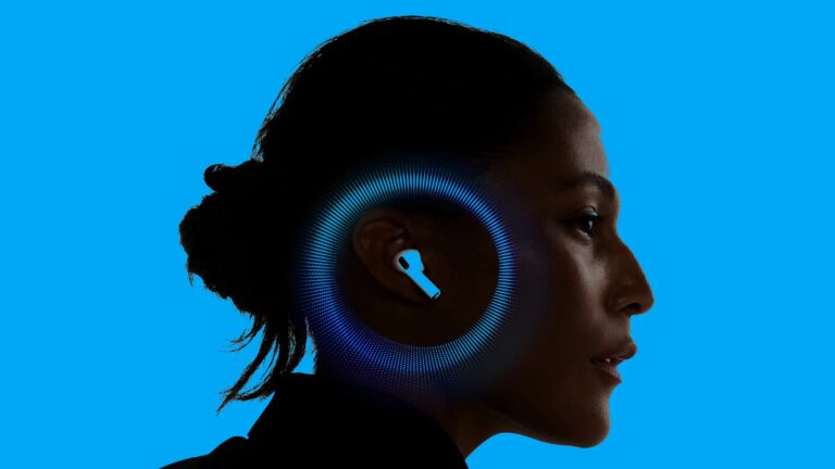 Profile of a woman with dark hair tied back, wearing a white wireless earbud in her right ear, set against a bright blue background with a circular blue soundwave pattern around the earbud.