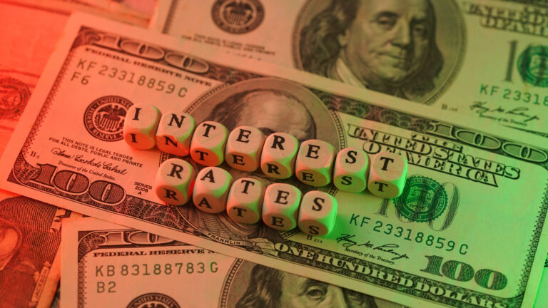 Dow Hits New Intraday High on Fed Day: Stock Market Today interest rates green red hundred dollar bills