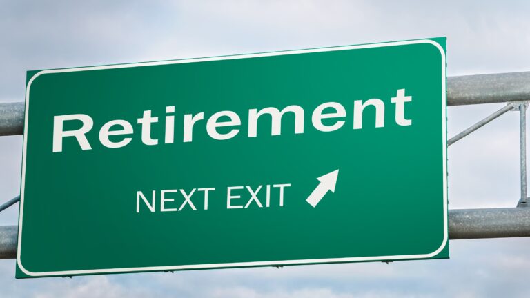 A highway sign says &quot;Retirement Next Exit&quot; with an arrow.