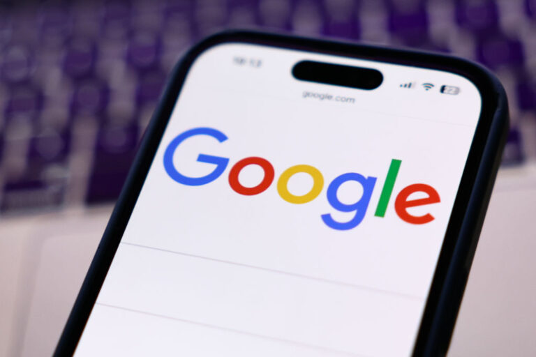 How to Add Preferred News Sources to Google Top Stories Google logo displayed on a cell phone