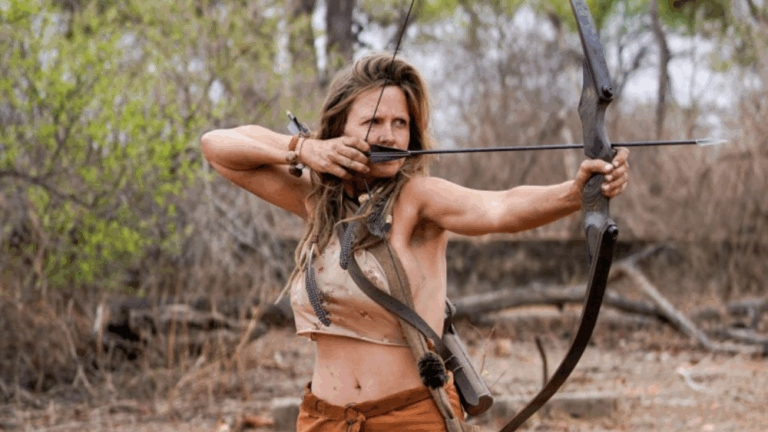 Teal Bulthuis firing a bow and arrow in Naked and Afraid: Apocalypse