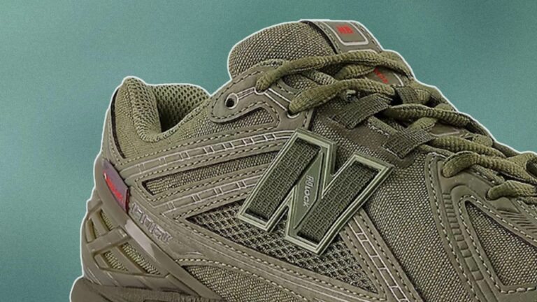 Close-up of an olive green New Balance sneaker featuring mesh and synthetic materials, with detailed stitching and the