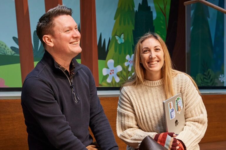 Two smiling Salesforce employees in Sweden.