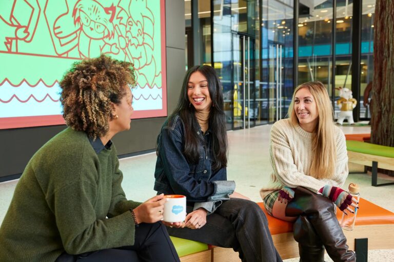 A group of smiling Salesforce employees in Switzerland.