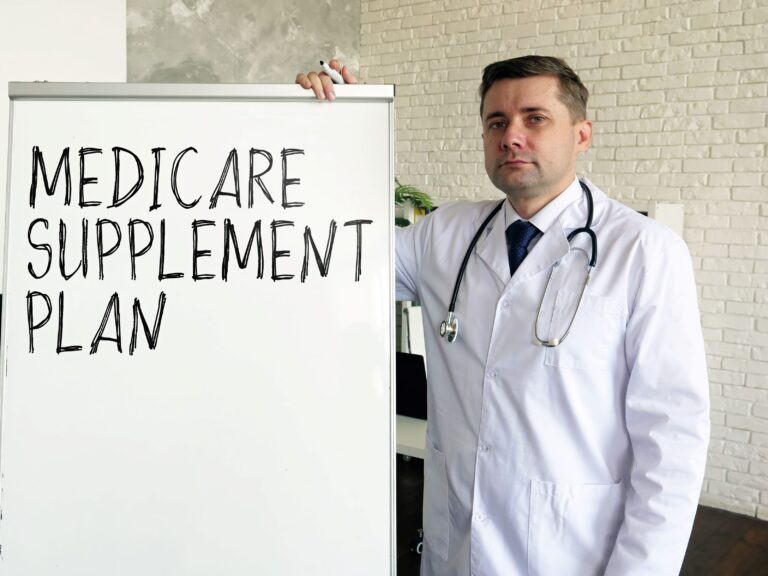 The ‘100% Overwhelming’ Decision: What Do You Do About Medigap? A doctor stands next to a dry erase board with Medicare Supplement Plan written on it
