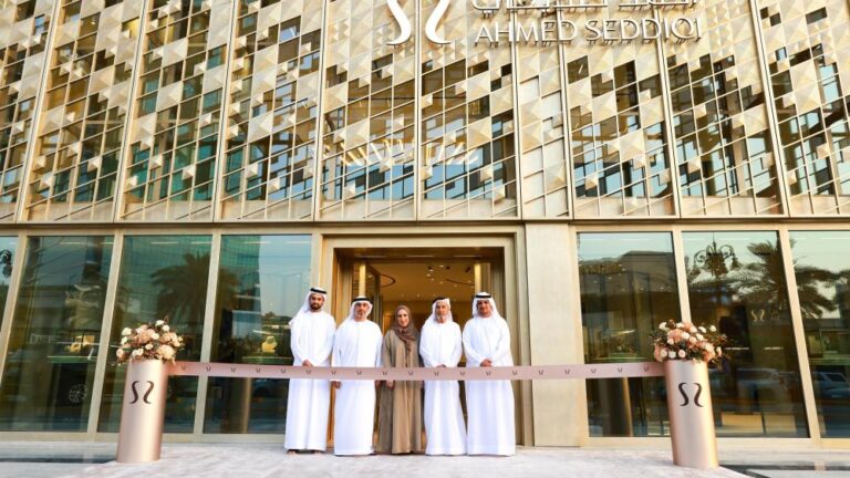 Ahmed Seddiqi Opens First Saudi Arabia Flagship in Riyadh Ahmed Seddiqi family members stand at ribbon-cutting ceremony in front of new Riyadh flagship boutique with geometric patterned facade and brand signage