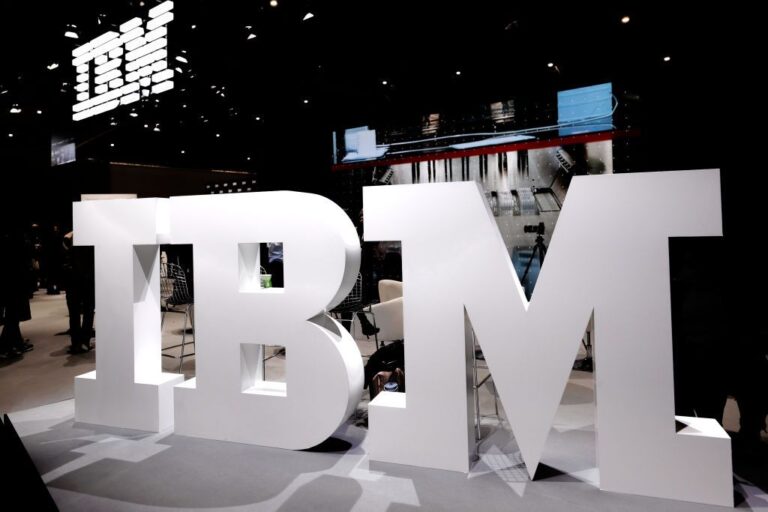 Dow Adds 472 Points After September CPI: Stock Market Today IBM logo in big white block lettering displayed on pavilion during 2024 Mobile World Congress in Barcelona