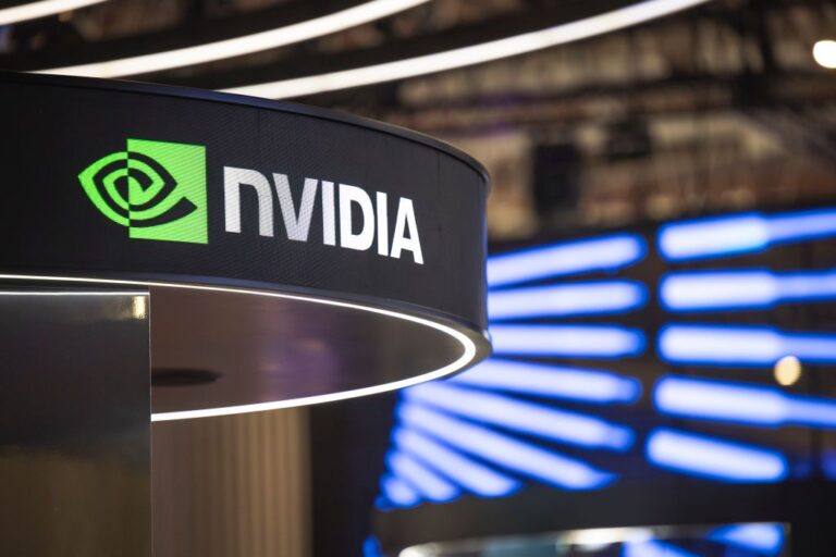 Dow, S&P 500 Slip on December Rate Cut Worries, Nvidia Boosts Nasdaq: Stock Market Today A logo sits illuminated at the NVIDIA booth in Mobile World Congress 2025 on March 6, 2025 in Barcelona, Spain