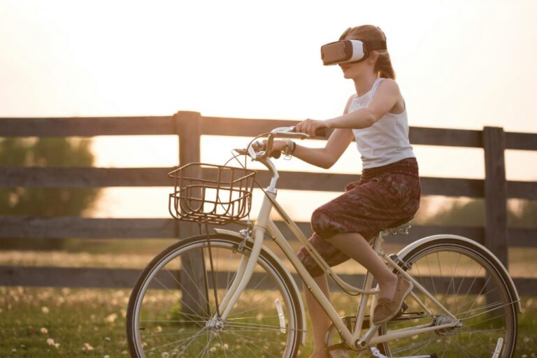 Great PR persuades world Pinocchio is real. by Phil Rhodes A woman on a bicycle wearing a virtual reality headset.