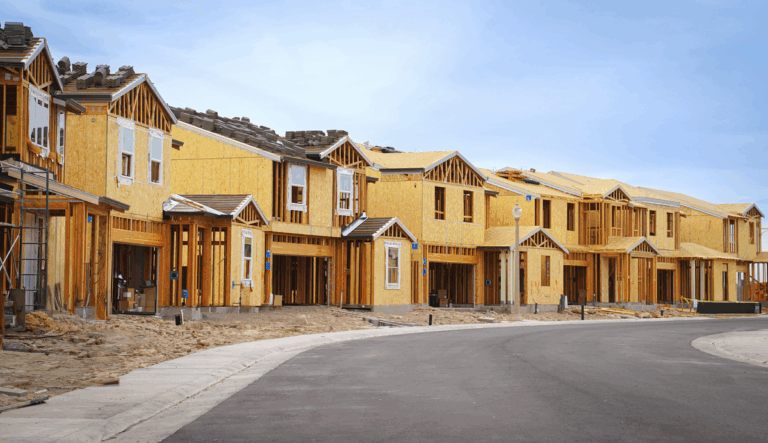 Is Owens Corning a Buy After Investment Advisor Paradiem Boosted Its Position in the Stock? A row of houses sit under construction.