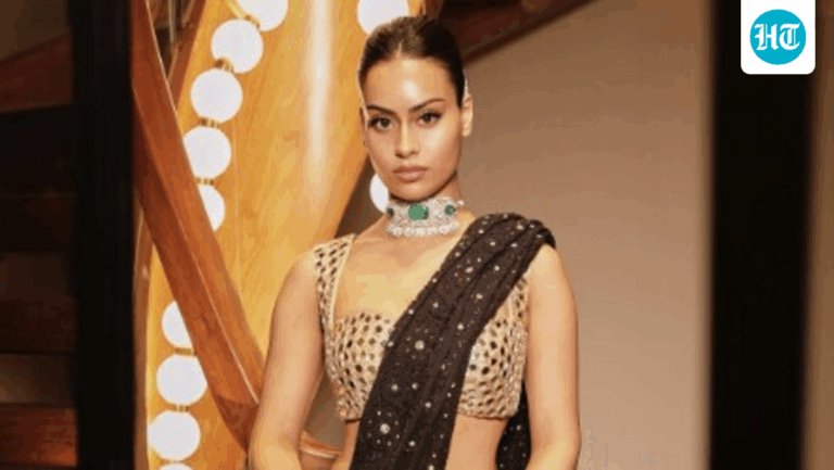 Nysa Devgan stuns in black sequined saree, emerald choker. See photos